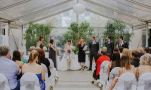 Simone Pfeiffer registered marriage celebrant in Rutherglen Victoria conducting indoor wedding ceremony.