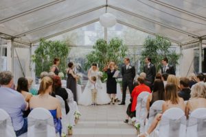 Simone Pfeiffer registered marriage celebrant in Rutherglen Victoria conducting indoor wedding ceremony.